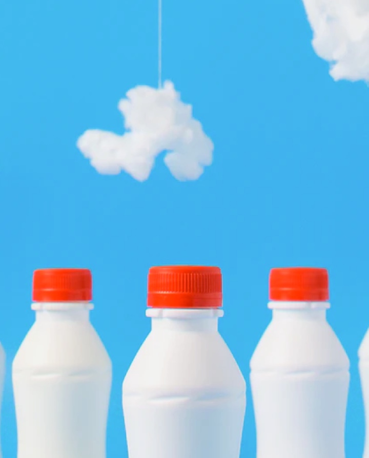 milk bottles with a cloudy background